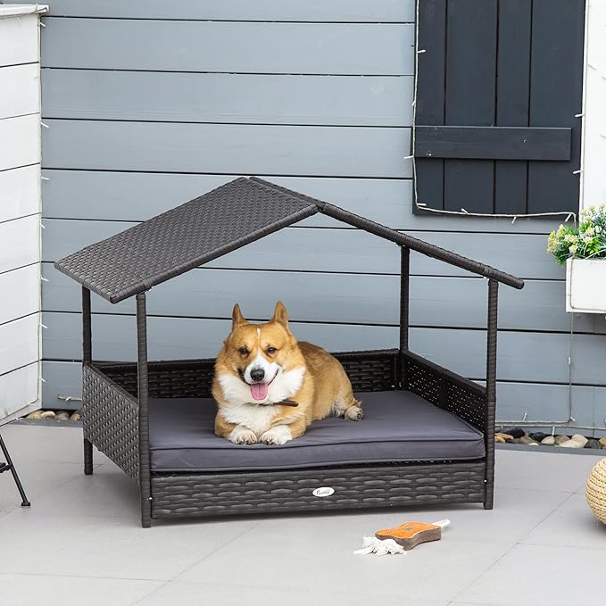 PawHut Wicker Dog House Outdoor with Canopy, Rattan Dog Bed with Water-Resistant Cushion, Raised Dog Bed for Small, Medium Dogs up to 66 lbs, 19.75" in Length, Brown Wicker, Gray Cushion